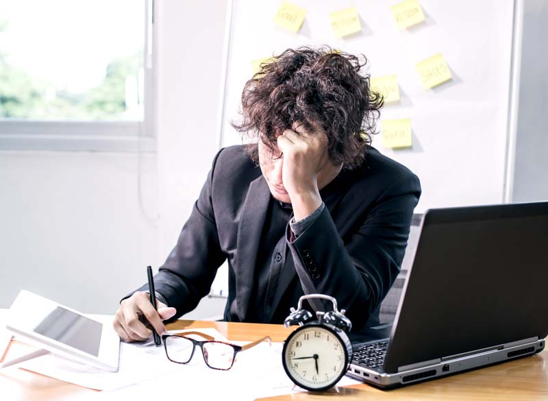 stressed-adult-at-desk-with-laptop-and-clock-2026-03-26-09-47-45-utc